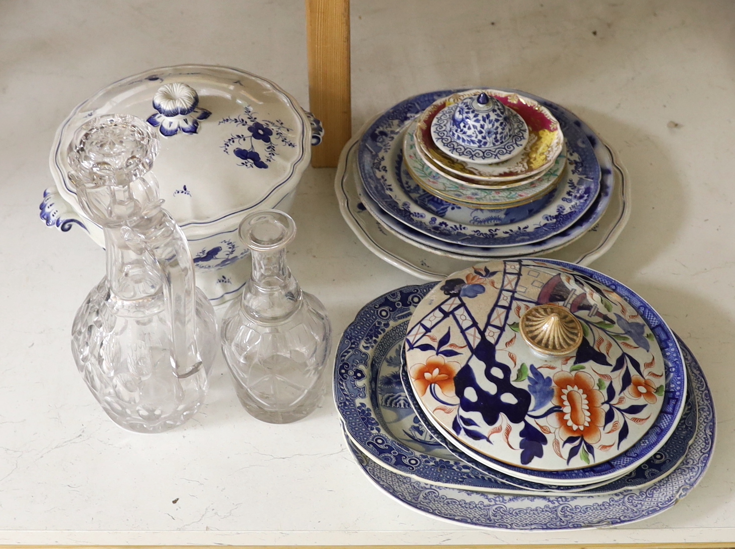 A quantity of assorted ceramics and glass including a group of 19 century blue and white pottery, a Victorian heavy cut glass decanter and stopper etc.